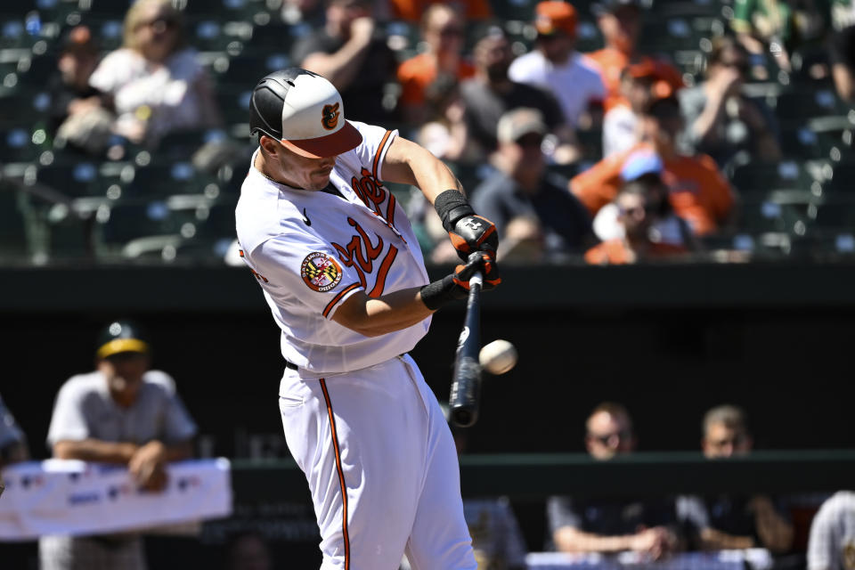 Baltimore Orioles' Ryan Mountcastle hits solo home run against Oakland Athletics starting pitcher Adam Oller during the third inning of a baseball game, Thursday, April 13, 2023, in Baltimore. (AP Photo/Terrance Williams)