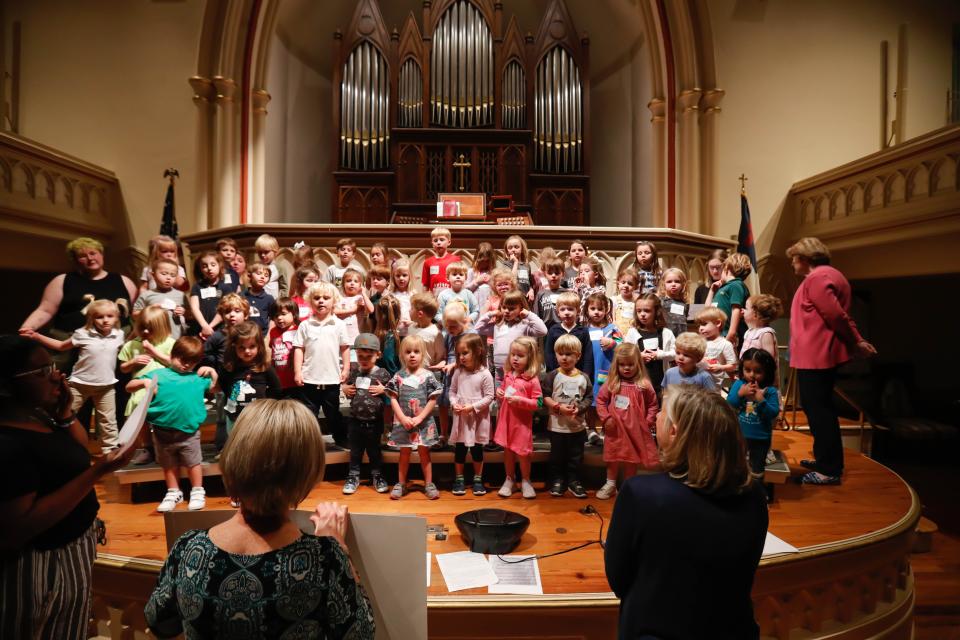 More than 60 children in grades Pres-K and kindergarten rehearse for the Children of the Light concert at Wesley Monumental United Methodist Church.