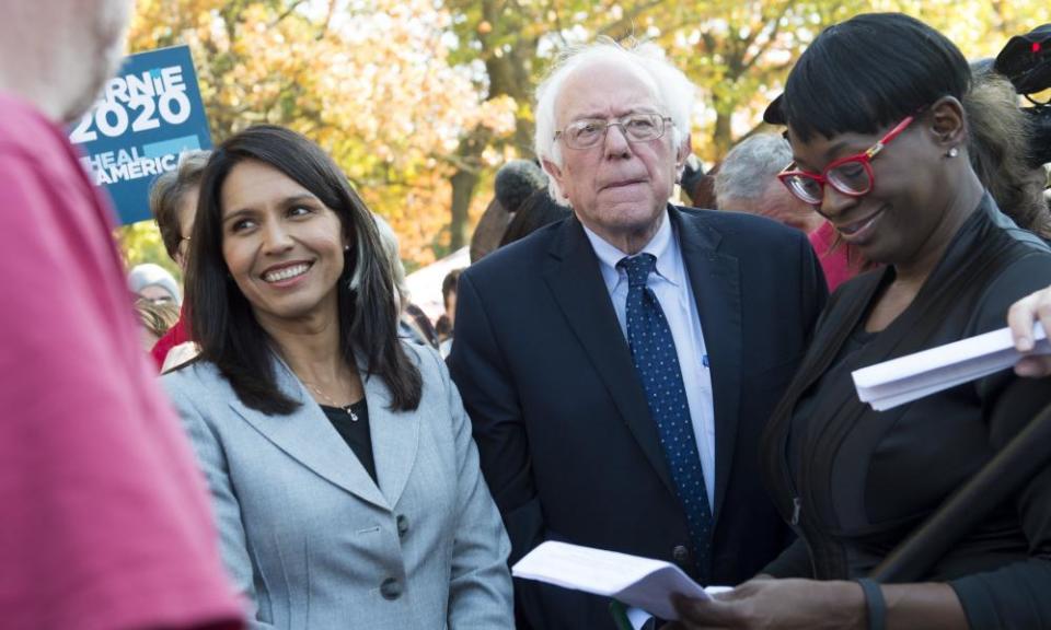 Tulsi Gabbard (left) with Bernie Sanders at a rally to stop the Trans-Pacific Partnership (TPP) on 17 November. 