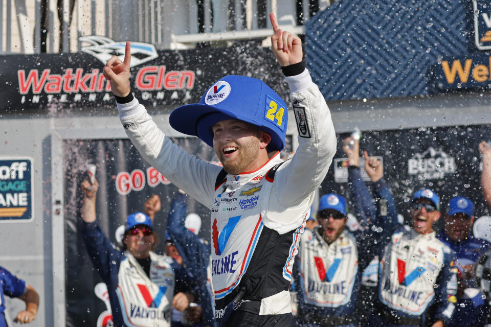 William Byron celebrates after his win in a NASCAR Cup Series auto race in Watkins Glen, N.Y., Sunday, Aug. 20, 2023. (AP Photo/Jeffrey T. Barnes)