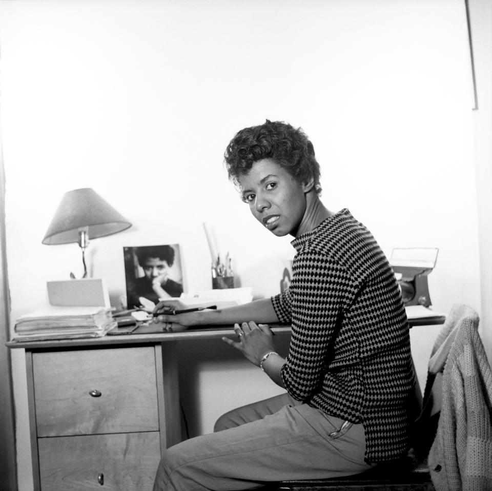 In this 1959 photo, Lorraine Hansberry sits in her New York City apartment at 337 Bleecker Street, which is where she wrote "A Raisin In The Sun"