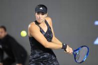 Garbine Muguruza of Spain, returns a shot to Karolina Pliskova of the Czech Republic, during a match of the Mexican Tennis WTA Finals in Guadalajara, Mexico, Wednesday, Nov. 10, 2021. (AP Photo/Refugio Ruiz)