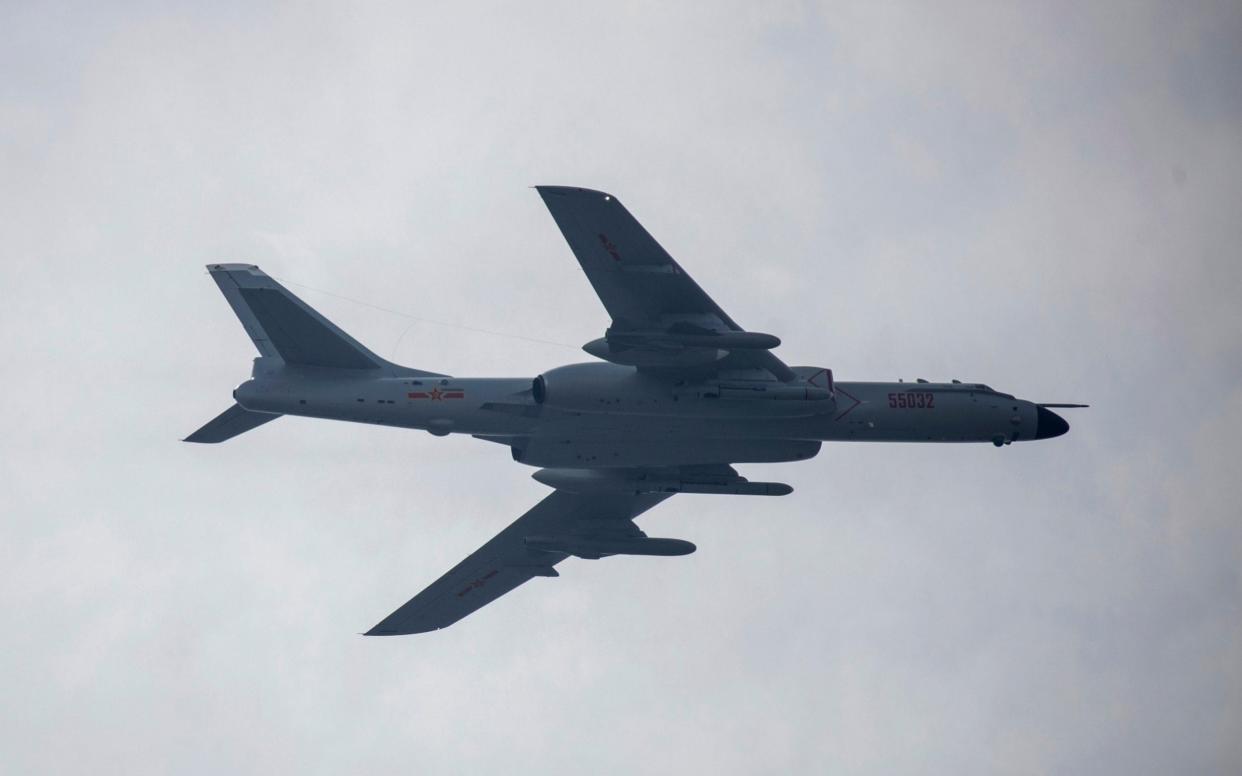 An H-6 bomber seen over Beijing in September - AP