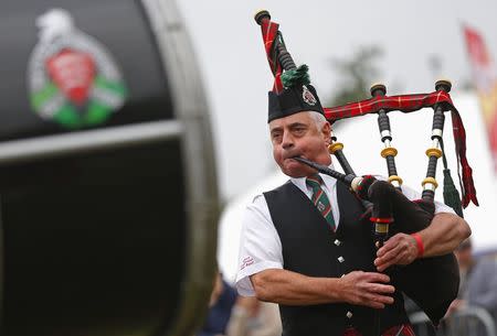 A competitor takes part in the Belgian Pipe Band Championship during the Scottish Weekend event in Belgium's Flanders village of Bilzen September 13, 2014. REUTERS/Yves Herman