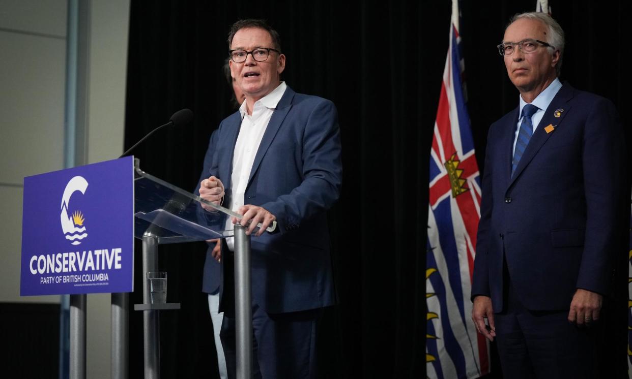 <span>The BC United leader, Kevin Falcon, speaks as BC Conservative leader John Rustad listens during a news conference in Vancouver on 28 August.</span><span>Photograph: Canadian Press/REX/Shutterstock</span>