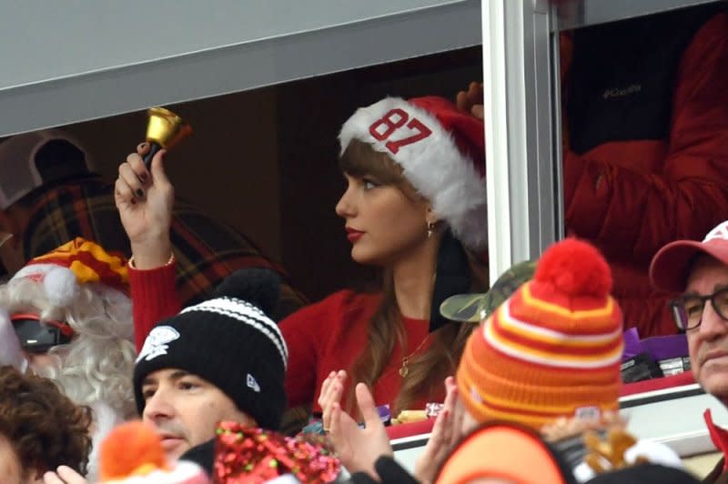 Taylor Swift rings a bell after her boyfriend, Kansas City Chiefs tight end Travis Kelce, makes a reception against the Las Vegas Raiders at Arrowhead Stadium in Kansas City, Mo., on December 25. File Photo by Dave Kaup/UPI