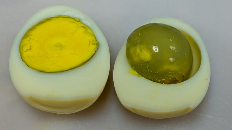 hard-boiled egg split with green yolk
