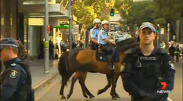 Police took no chances and turned out in force to prevent violence. Photo: 7 News