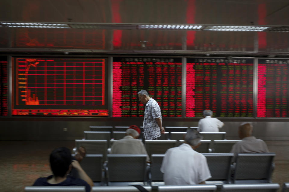 Chinese investors monitor stock prices at a brokerage house in Beijing, Thursday, June 27, 2019. Asian stocks advanced Thursday ahead of a meeting between U.S. President Donald Trump and Chinese leader Xi Jinping at the G-20 summit in Japan this week. (AP Photo/Andy Wong)