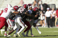 South Carolina linebacker Debo Williams (0) knocks the helmet off of Jacksonville State quarterback Zion Webb (10) during the second half of an NCAA college football game on Saturday, Nov. 4, 2023, in Columbia, S.C. (AP Photo/Artie Walker Jr.)