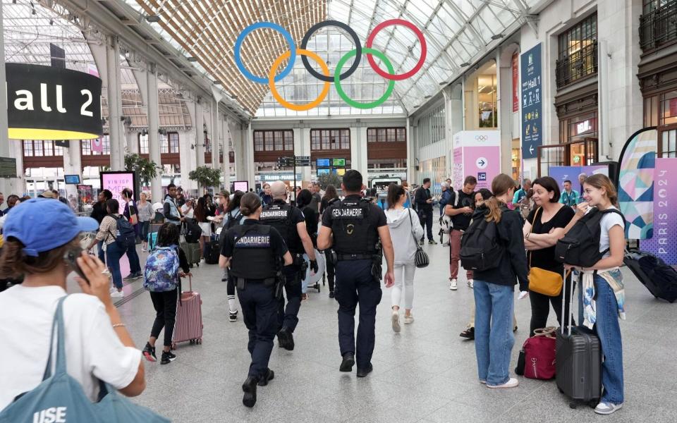 Police officers patrol Gare de Lyon train station