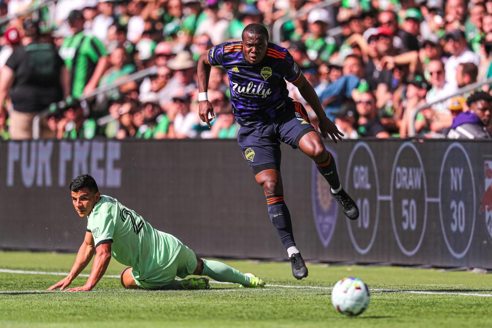 Seattle Sounders defender Nouhou hurdles Austin FC defender Nick Lima during Austin's 1-1 draw Sunday at Q2 Stadium.