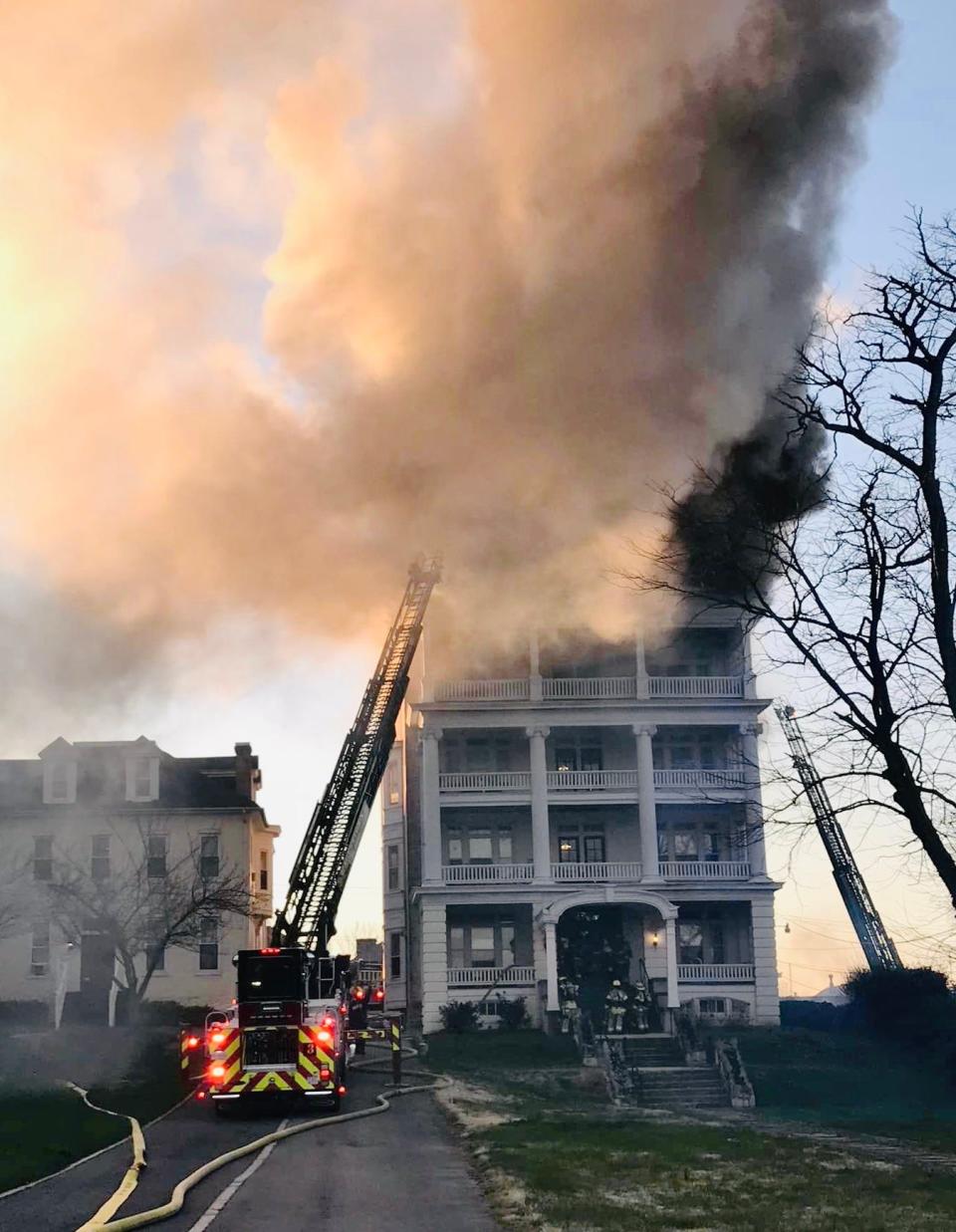 Smoke billows Thursday evening from the Mount Royal Apartments building on Oak Hill Avenue in Hagerstown as firefighters attempt to bring the fire under control.