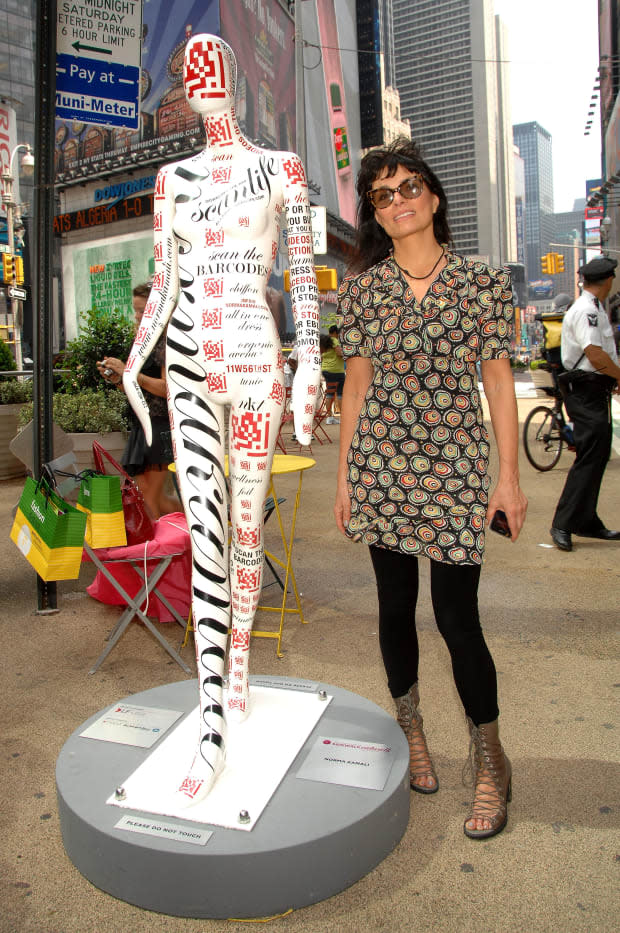 Norma Kamali with her mannequin for the "Fashion Center Sidewalk Catwalk" — featuring bar codes — in Manhattan's Herald Square in June 2010. <p>Photo: Marc Stamas/Getty Images</p>