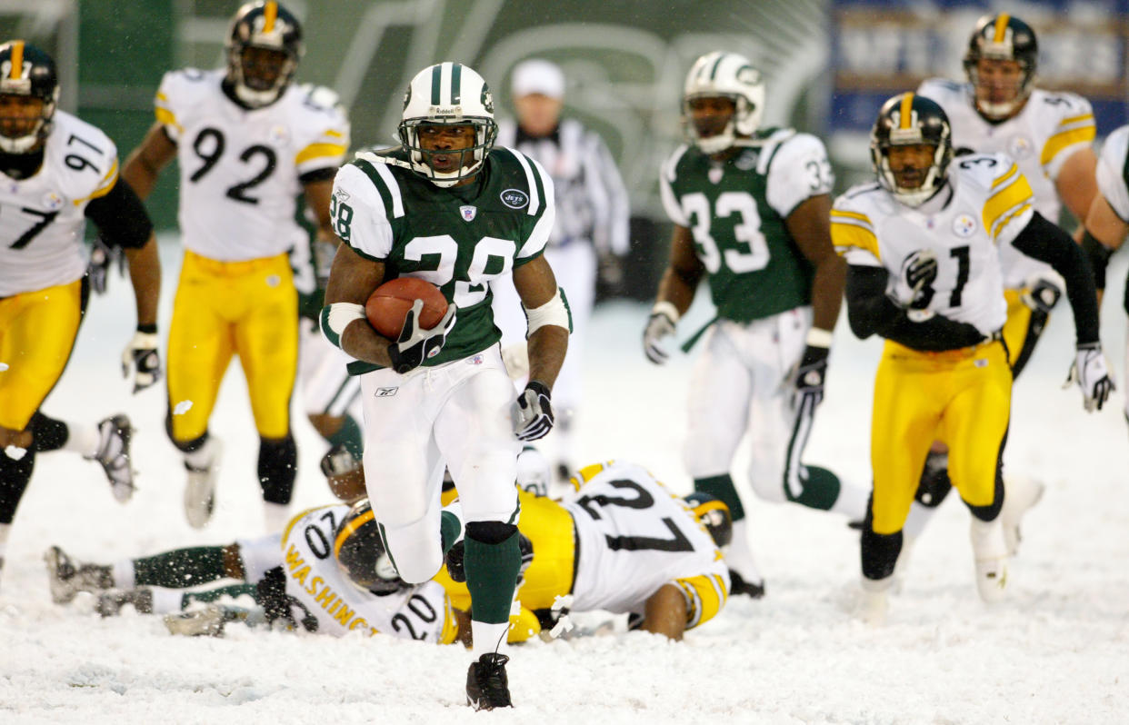 The New York Jets' Curtis Martin leaves a field of Pittsburg