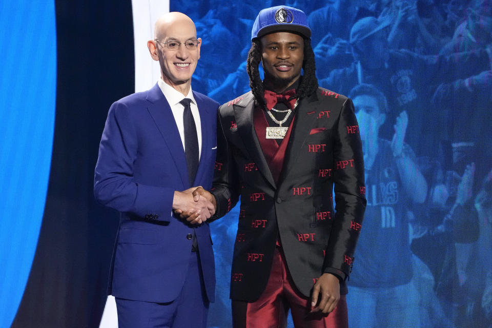 Cason Wallace poses for a photo with NBA Commissioner Adam Silver after being selected 10th overall by the Dallas Mavericks during the NBA basketball draft, Thursday, June 22, 2023, in New York. (AP Photo/John Minchillo)