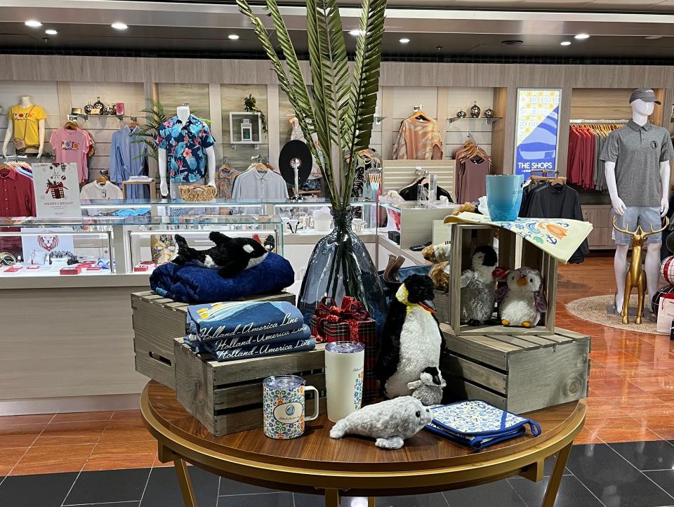 holland america gift shop with round table display of clothes and mugs