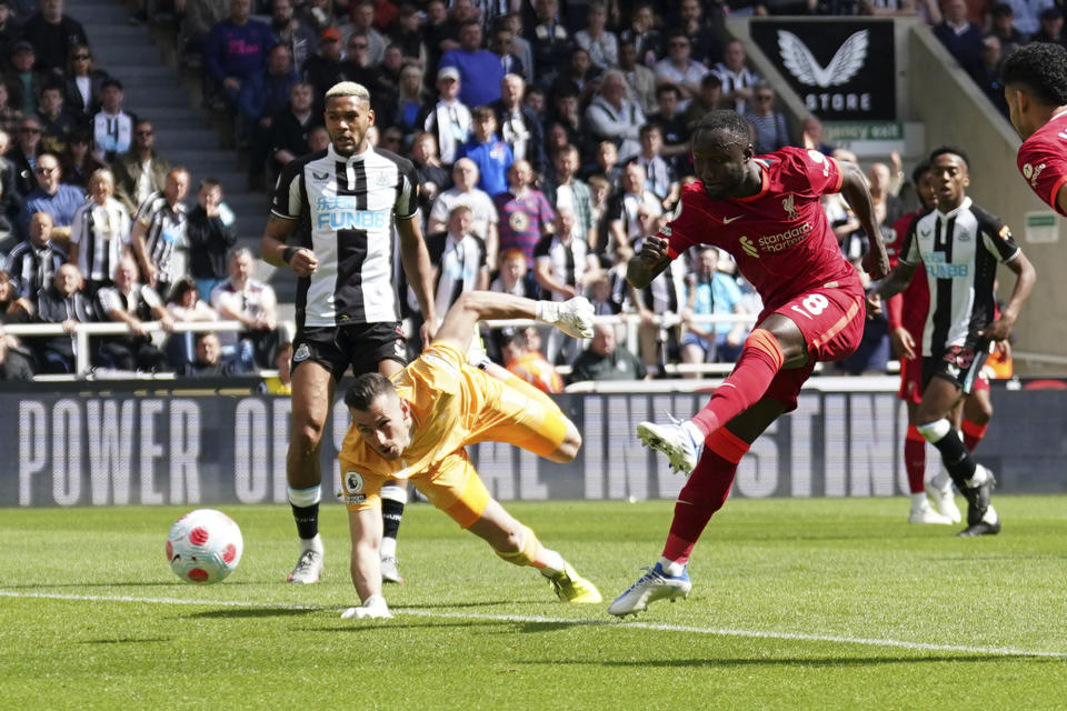 Liverpool's Naby Keita, 8, scores his side's first goal during the English Premier League soccer match between Newcastle United and Liverpool at St. James' Park stadium in Newcastle, England, Saturday, April 30, 2022. (AP Photo/Jon Super)