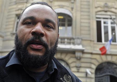 French humorist Dieudonne M'bala M'bala speaks with journalists after handing in the European candidates list at the French Interior Ministry in Paris May 13, 2009. REUTERS/Gonzalo Fuentes