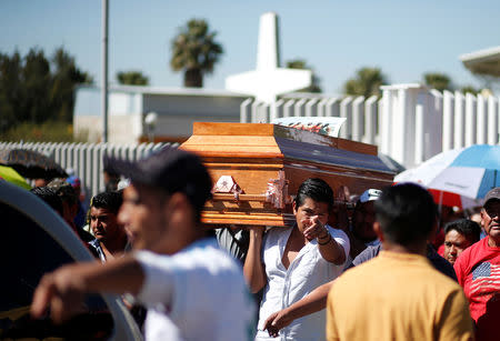 Relatives of a man who died in an explosion of a fuel pipeline ruptured by oil thieves carry his coffin after a funeral mass at a church in the municipality of Tlahuelilpan, state of Hidalgo, Mexico January 21, 2019. REUTERS/Mohammed Salem