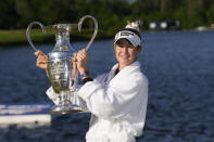 Nelly Korda poses with the trophy after winning the Chevron Championship LPGA golf tournament Sunday, April 21, 2024, at The Club at Carlton Woods in The Woodlands, Texas. (AP Photo/David J. Phillip)