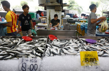 A shopkeeper waits for customers at a wet market in Malaysia's southern city of Johor Bahru April 26, 2017. REUTERS/Edgar Su