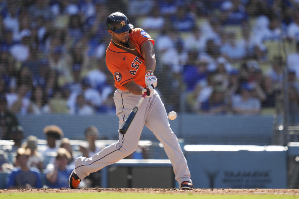 Houston Astros' Jose Abreu (79) hits a home run during the fourth inning of a baseball game against the Los Angeles Dodgers in Los Angeles, Sunday, June 25, 2023. Kyle Tucker also scored. (AP Photo/Ashley Landis)