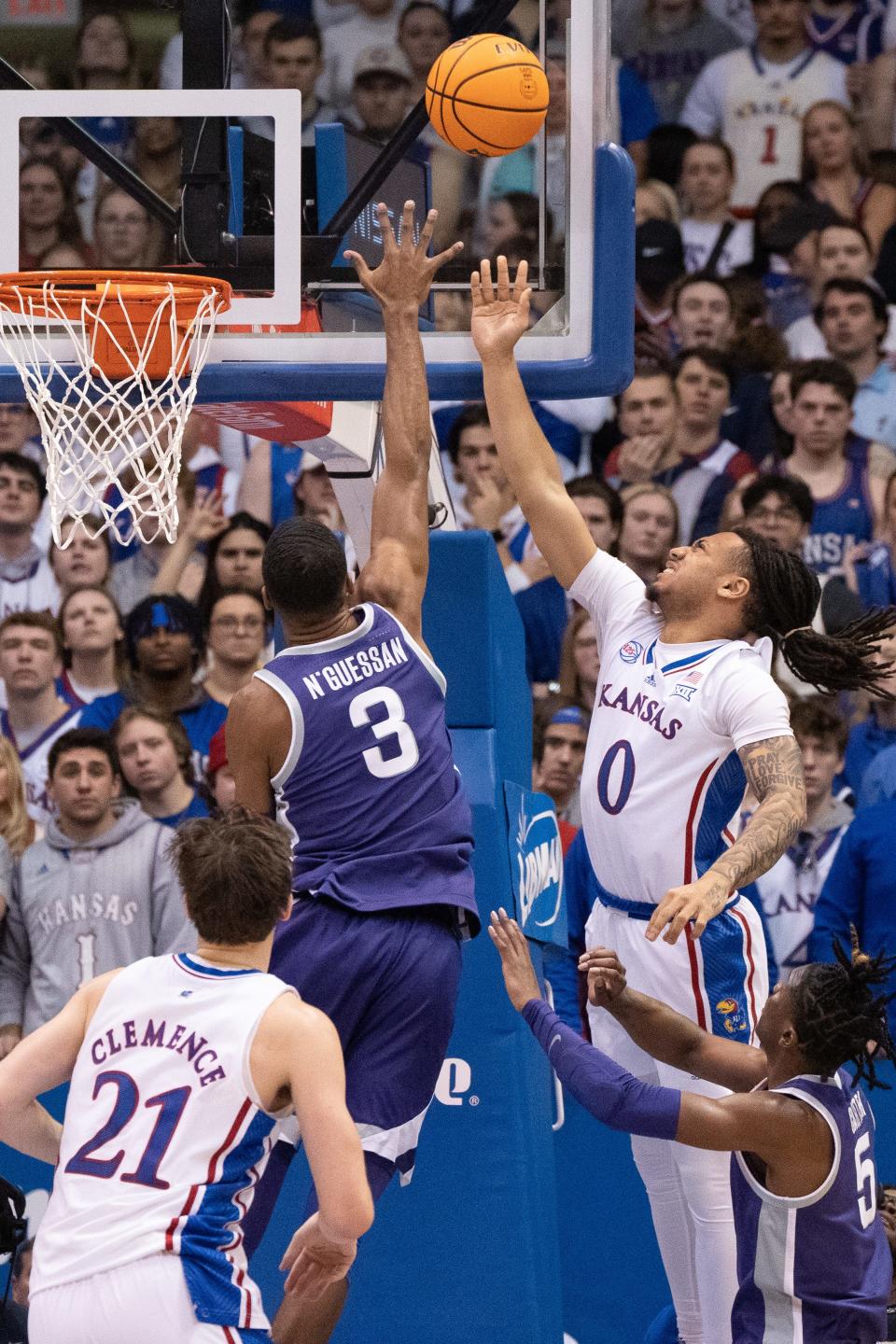 Kansas sophomore guard Bobby Pettiford Jr. (0) floats a layup in during the second half of Tuesday's Sunflower Showdown against Kansas State inside Allen Fieldhouse.