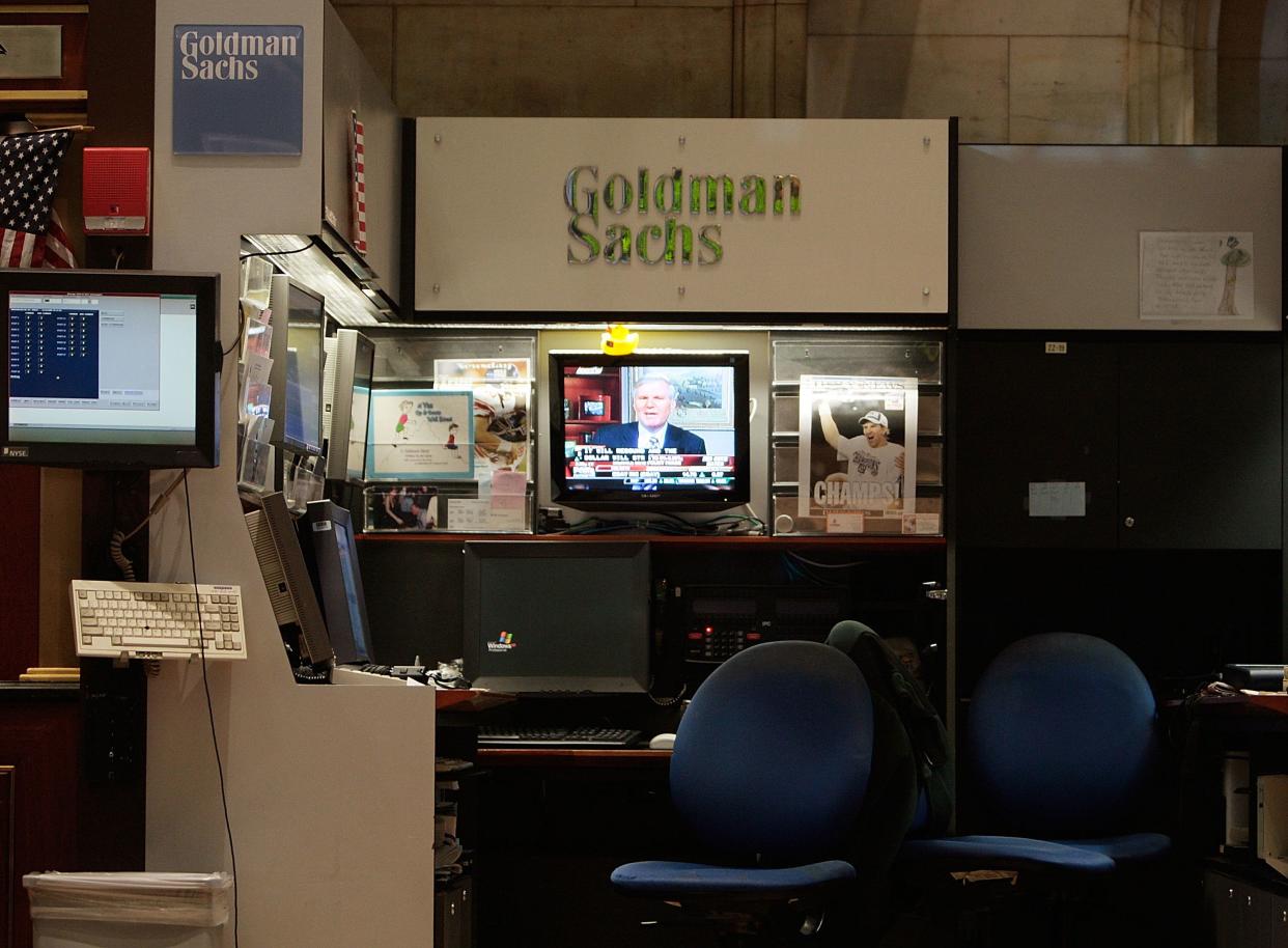 A television plays at the The Goldman Sachs booth on the floor of the New York Stock Exchange during afternoon trading December 16, 2008 in New York City