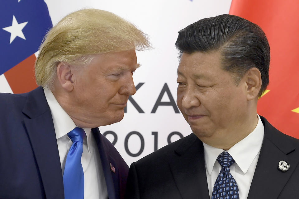 FILE - In this June 29. 2019, file photo, President Donald Trump, left, meets with Chinese President Xi Jinping during a meeting on the sidelines of the G-20 summit in Osaka, Japan. Trump is prioritizing China trade negotiations over defending the Hong Kong protesters. This contrasts with the stance normally taken by his White House predecessors, who would use such a flashpoint as a moment to espouse an American commitment to democratic values.(AP Photo/Susan Walsh, File)