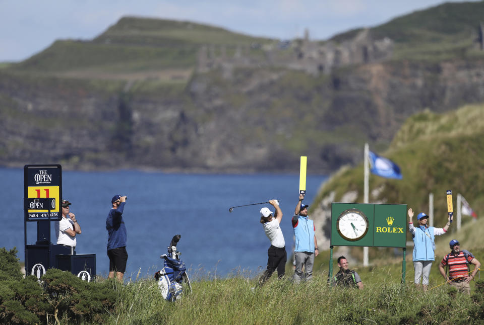 England's Tommy Fleetwood plays off the the 11th tee at Royal Portrush Golf Club during a practice round ahead of the 148th Open Golf Championship, in Portrush, Northern Ireland, Sunday, July 14, 2019. The Open Golf Championships takes place between 18-21 July. (AP Photo/Peter Morrison)