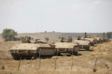 FILE PHOTO: Israeli armoured vehicles take part in a army drill after the visit of Israeli Defence Minister Avigdor Lieberman in the Israeli-occupied Golan Heights, Israel, August 7, 2018. REUTERS/Amir Cohen/Filr Photo