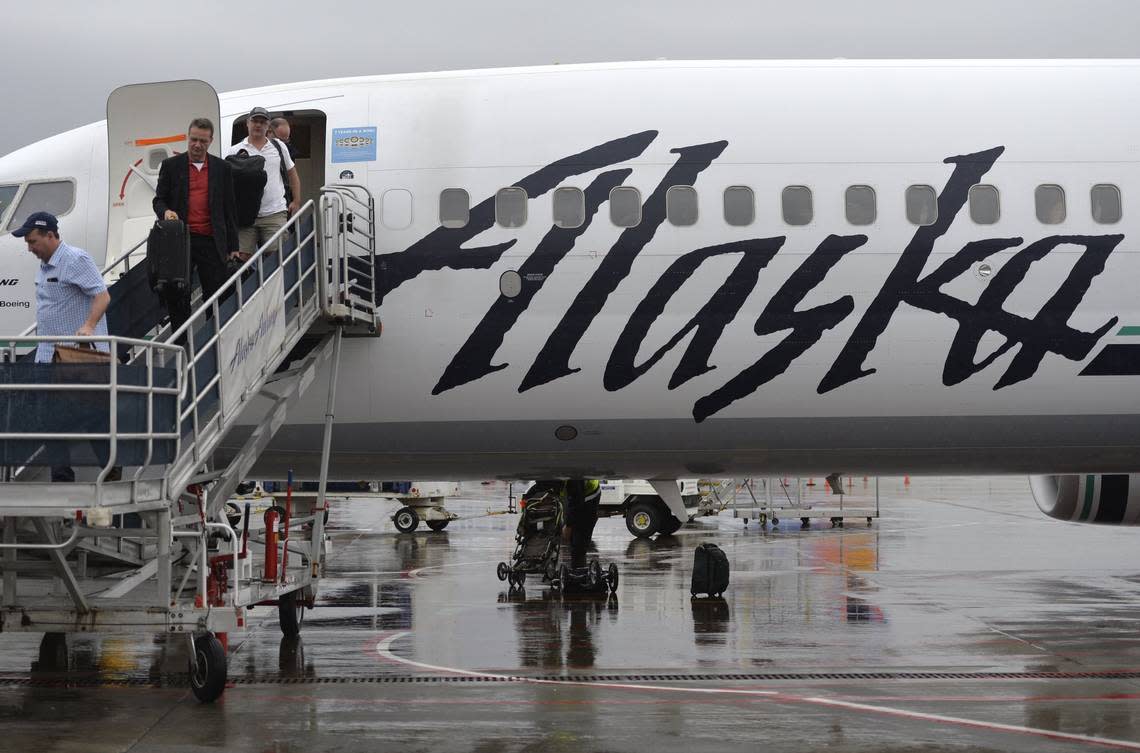 Passengers disembark from an Alaska Airlines plane arriving from Las Vegas at Bellingham International Airport on Feb. 25, 2015. Staff/The Bellingham Herald file