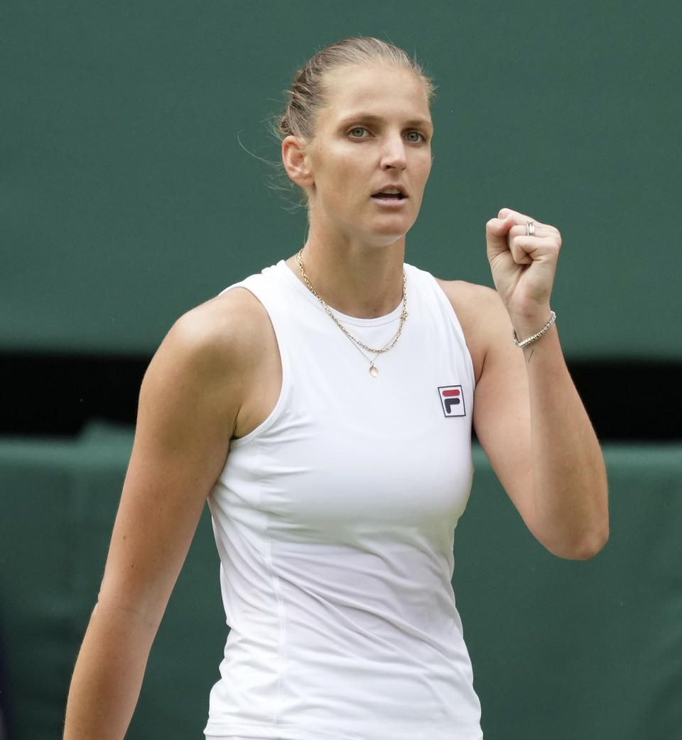 Czech Republic's Karolina Pliskova celebrates winning a point during the women's singles semifinals match against Aryna Sabalenka of Belarus on day ten of the Wimbledon Tennis Championships in London, Thursday, July 8, 2021. (AP Photo/Alberto Pezzali)