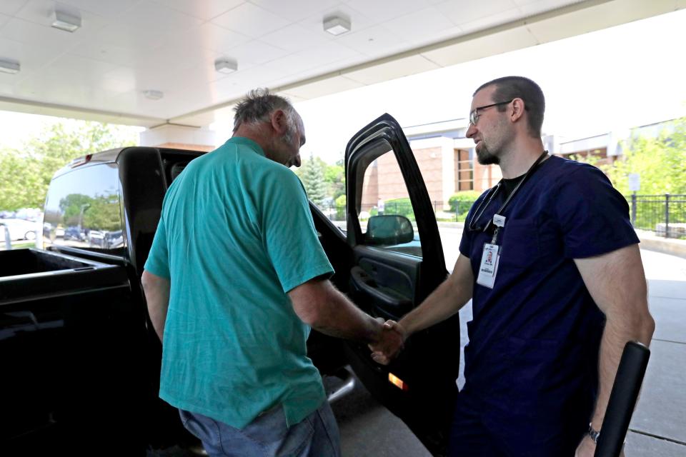 Bob Gudex, left, of Campbellsport thanks Christopher Johnson, RN, as he is assisted to his vehicle upon discharge at SSM St. Agnes Hospital Tuesday, May 23, 2023, in Fond du Lac.