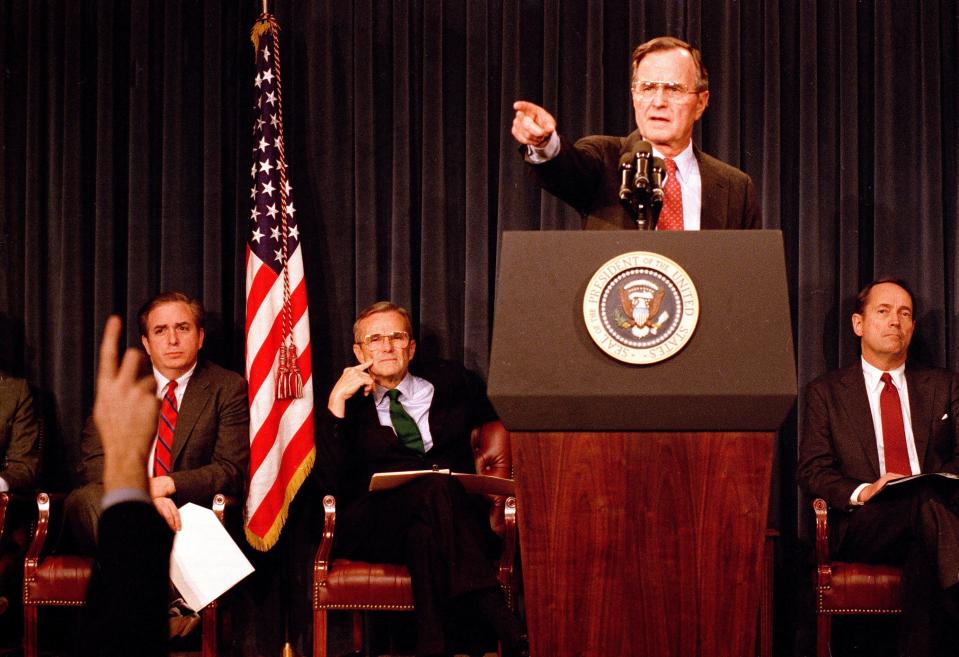 President George H.W. Bush points to a reporter during a news conference on Feb. 6, 1989 — likely his second formal one — at the Old Executive Office Building to unveil a plan to bail out this nation's savings and loan institutions.