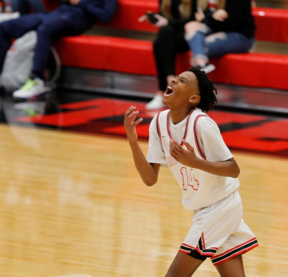 Richmond freshman Cedric Horton-Hogg reacts after a turnover against Victory College Prep Dec. 28, 2021, in the Bob Wettig Memorial Tournament.