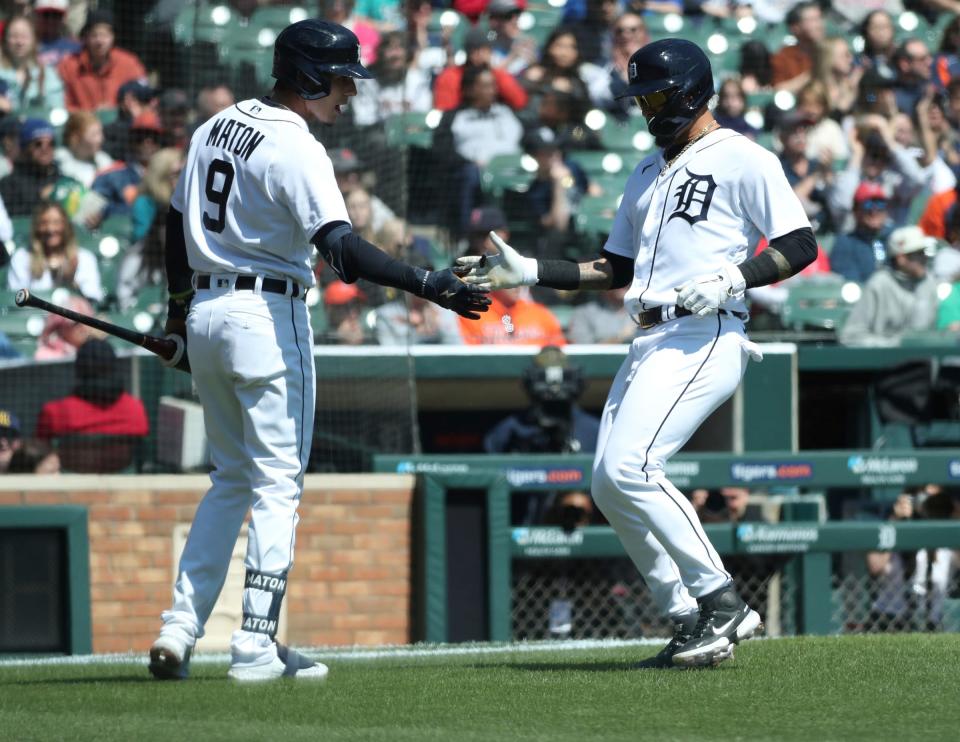 Detroit Tigers third baseman Nick Maton (9) meets Javier Baez (28) at home after scoring against the Boston Red Sox during the first inning at Comerica Park in Detroit on Sunday, April 9, 2023.