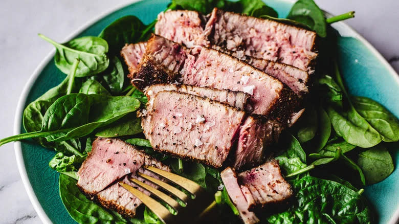 tuna steak sliced on salad