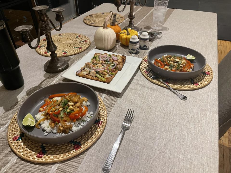 A photo taken by SPY editor Taylor Galla of her dinner table, with two Hello Fresh meals on it. 