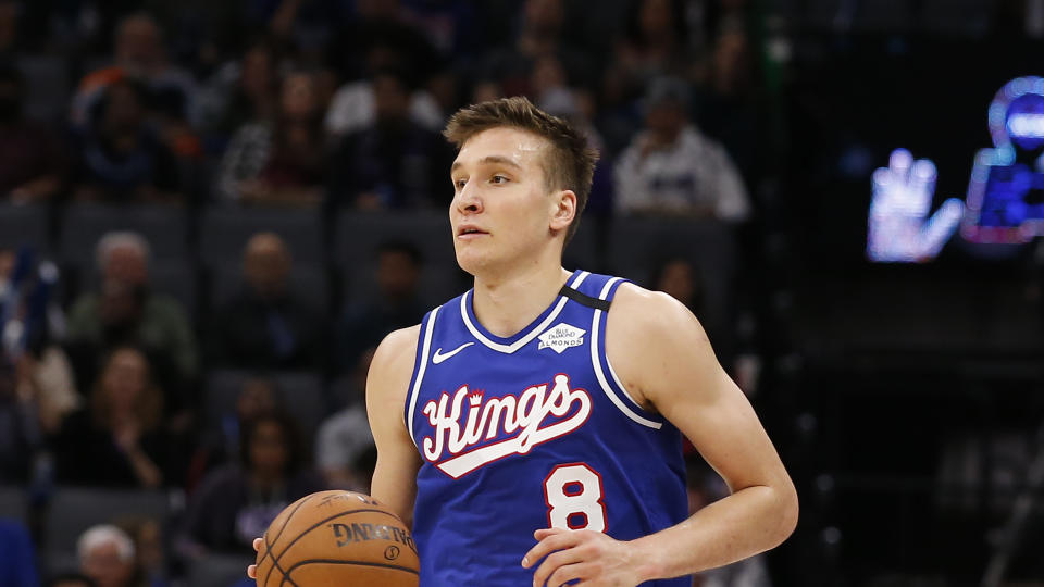 Sacramento Kings guard Bogdan Bogdanovic dribbles down court during the second half of an NBA basketball game against the Philadelphia 76ers in Sacramento, Calif., Thursday, March 5, 2020. The 76ers won 125-108. (AP Photo/Rich Pedroncelli)