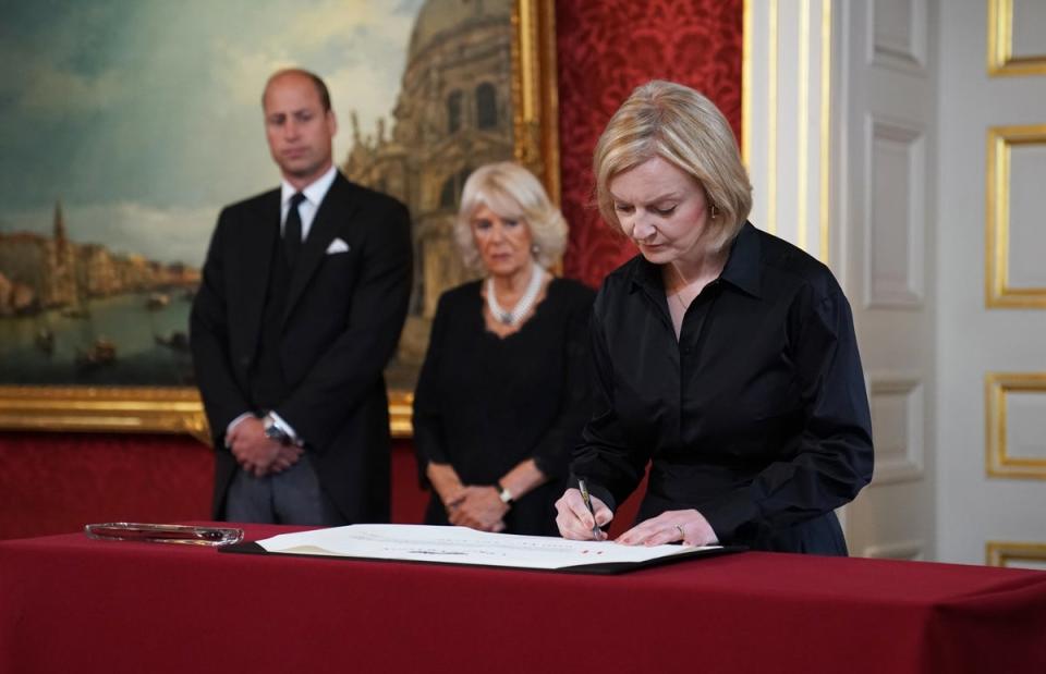 Prime Minister Liz Truss signs the Proclamation of Accession of King Charles III (Kirsty O’Connor/PA) (PA Wire)
