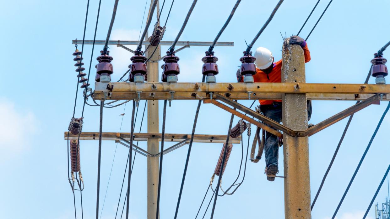 Electricity power-line installer making repairs