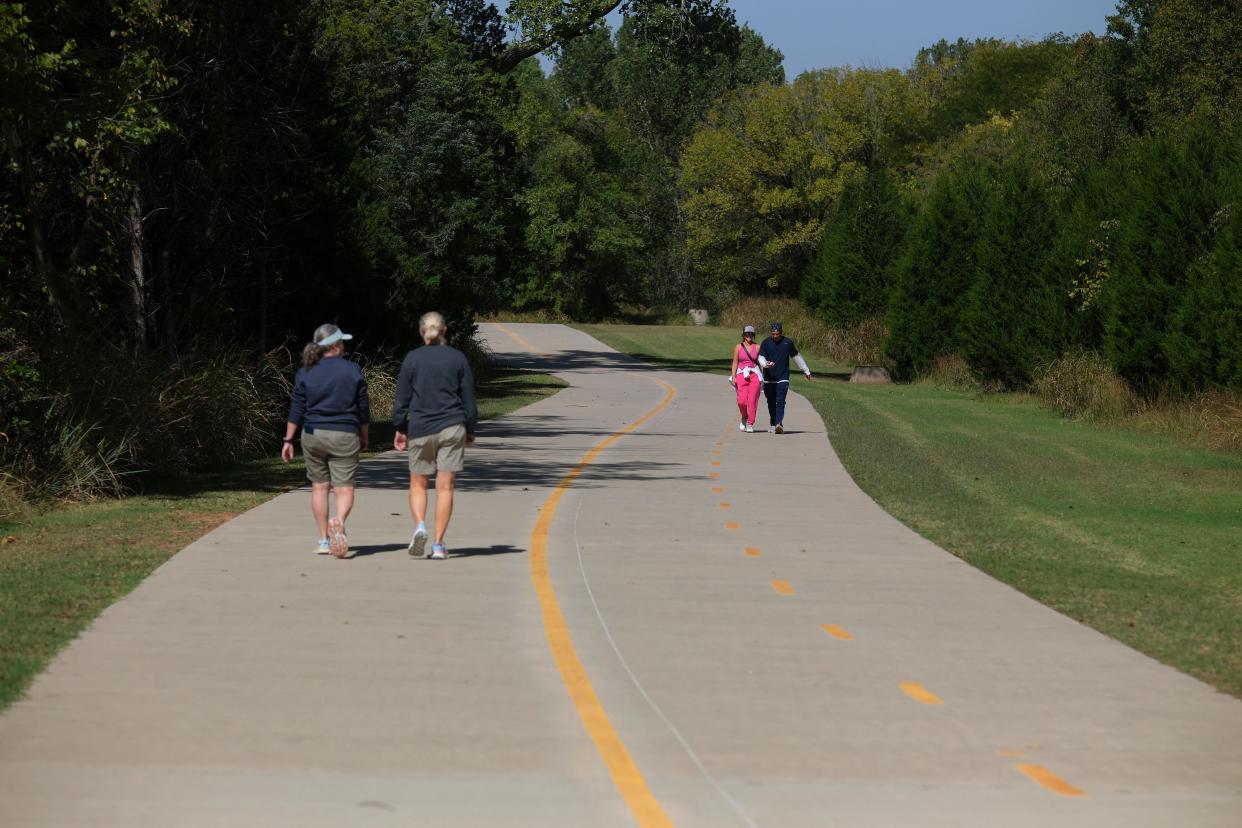 Walkers enjoy Edmond's Spring Creek Trail on Oct. 13. Edmond recently has approved agreements with Oklahoma's Department of Transportation to use federal dollars to expand Edmond's trail system around Arcadia Lake.