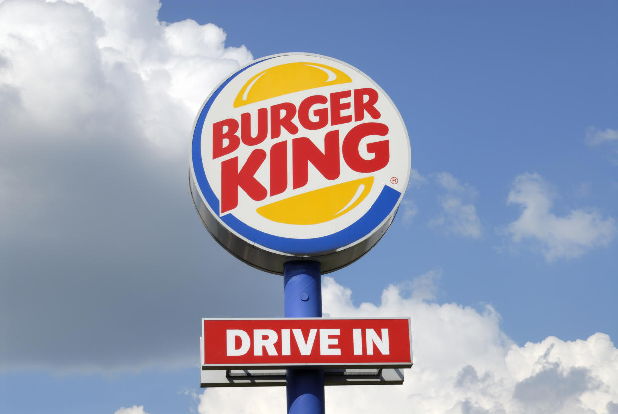 Karlsruhe, Germany - April 30, 2011: Huge drive in sign of a Burger King fast food restaurant in Germany against cloudy sky. Burger King is a worldwide operating chain of fast food restaurants.