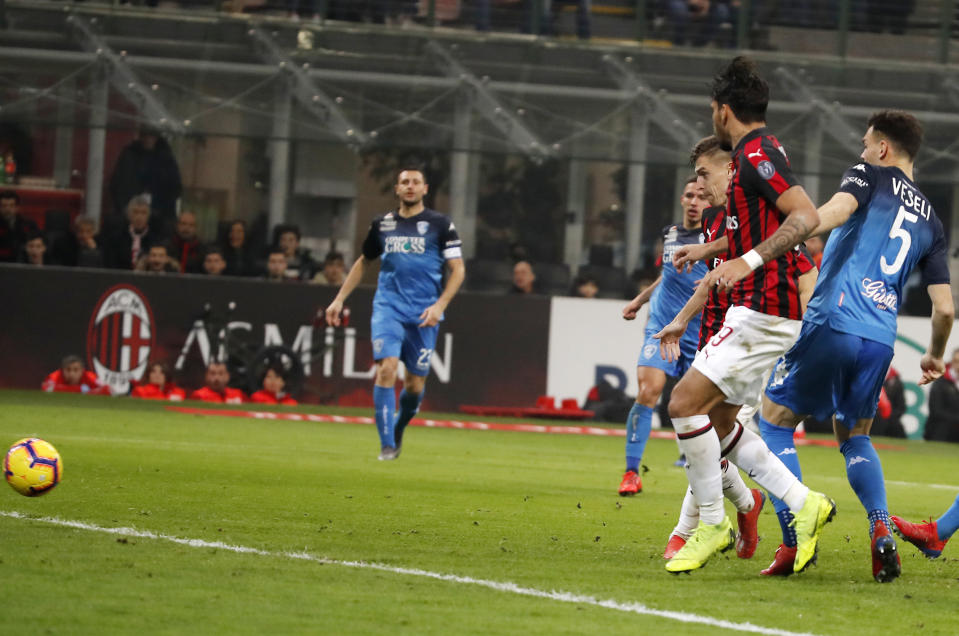 AC Milan's Krzysztof Piatek, third from right, scores his side's opening goal during the Serie A soccer match between AC Milan and Empoli at the San Siro stadium, in Milan, Italy, Friday, Feb. 22, 2019. (AP Photo/Antonio Calanni)