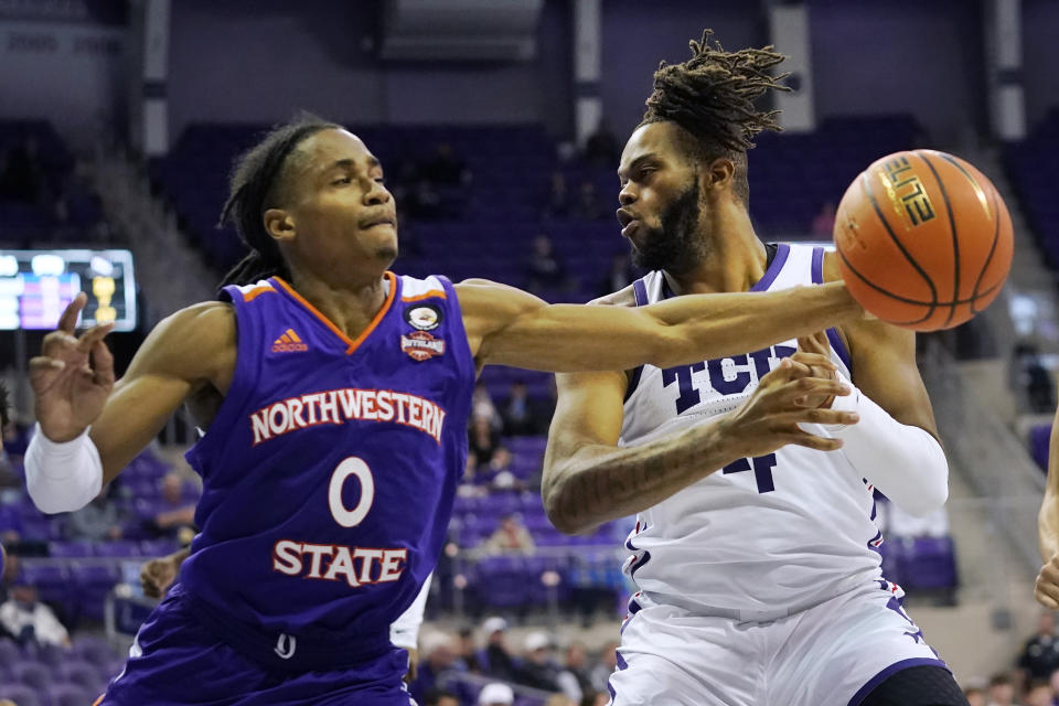 Northwestern State guard Demarcus Sharp steals the ball from TCU center Eddie Lampkin Jr. (4) during the second half of an NCAA college basketball game in Fort Worth, Texas, Monday, Nov. 14, 2022. Northwestern State won 64-63. (AP Photo/LM Otero)