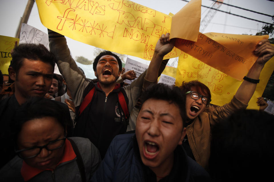 Students from northeastern states of India shout slogans during a protest in New Delhi, India, Saturday, Feb. 1, 2014. The beating and subsequent death in New Delhi of a university student, 20-year-old Nido Tania, from India's remote northeast has sparked a furious outcry against racism and criticism of police in the Indian capital. (AP Photo/Altaf Qadri)