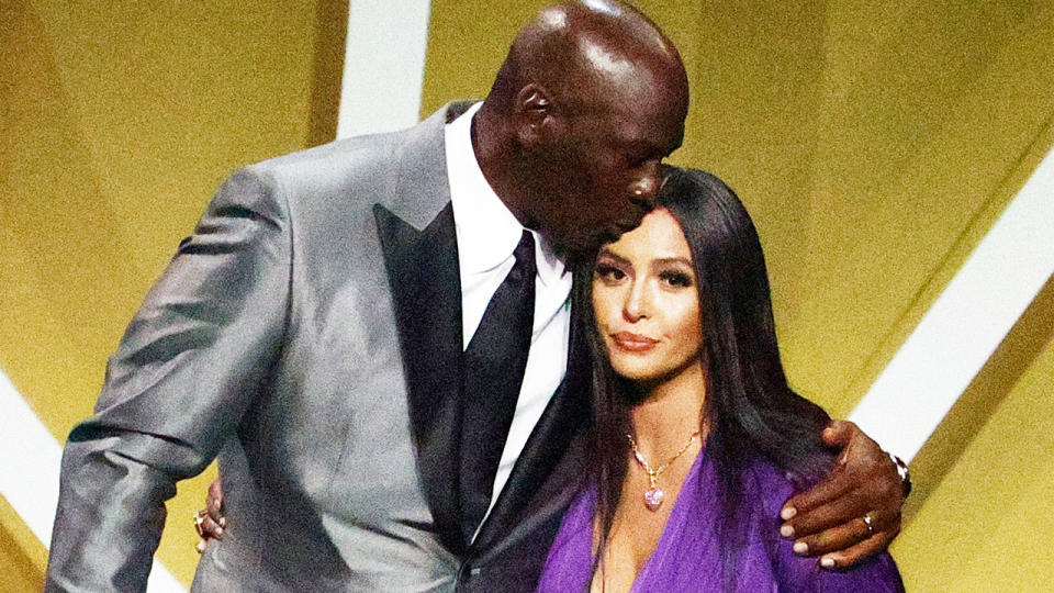 Vanessa Bryant (pictured right) greeted by presenter Michael Jordan (pictured left) on stage.