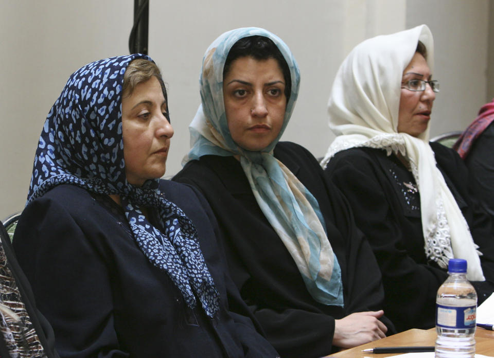 FILE - Prominent Iranian human rights activist Narges Mohammadi, center, sits next to Iranian Nobel Peace Prize laureate Shirin Ebadi, left, while attending a meeting on women's rights in Tehran, Iran, on Aug. 27, 2007. The Nobel Peace Prize has been awarded to Narges Mohammadi for fighting oppression of women in Iran. The chair of the Norwegian Nobel Committee announced the prize Friday, Oct. 6, 2023 in Oslo. (AP Photo/Vahid Salemi, File)